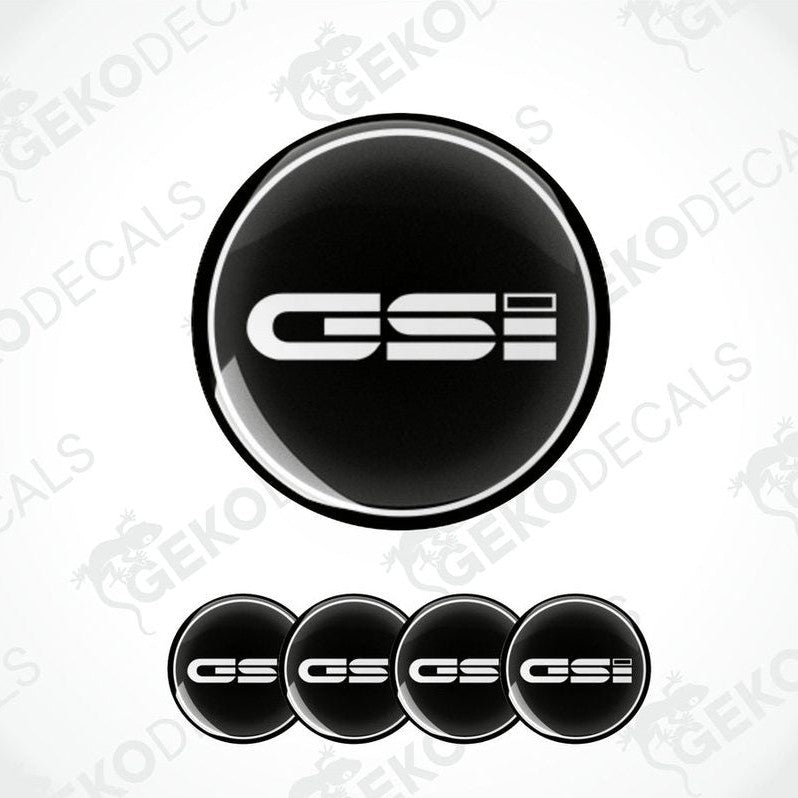 A set of black vinyl decals with 'OPEL GSi' text on them, typically used as car wheel caps.
