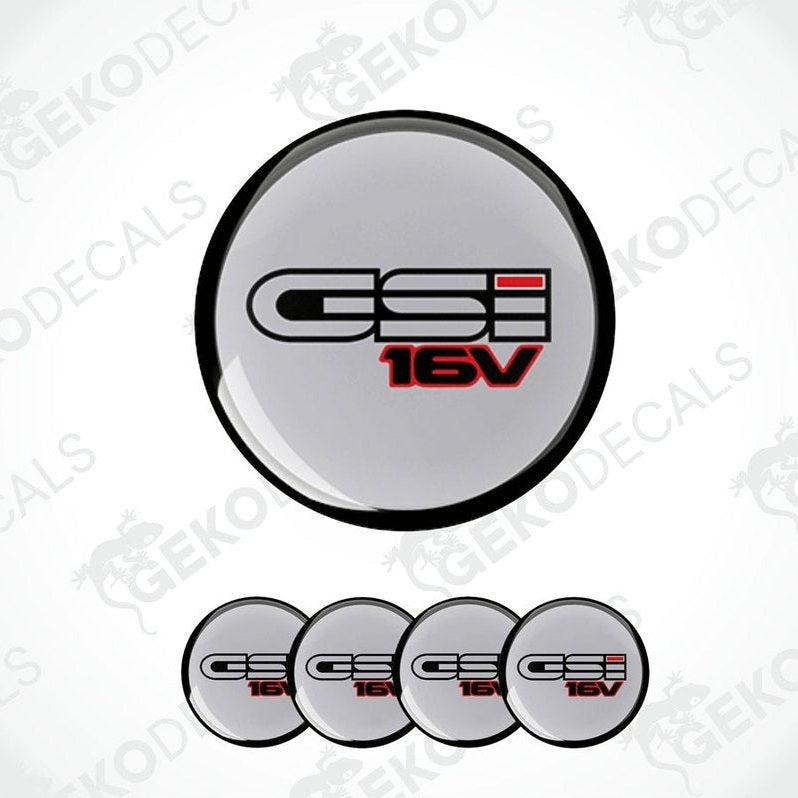 A set of four gray vinyl stickers with the text 'OPEL GSI 16V' and a red and white logo on them.