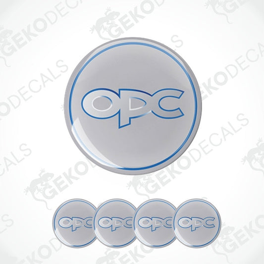 A set of four grey vinyl stickers with the text 'OPEL OPC' in the center, designed for use on vehicle wheels.