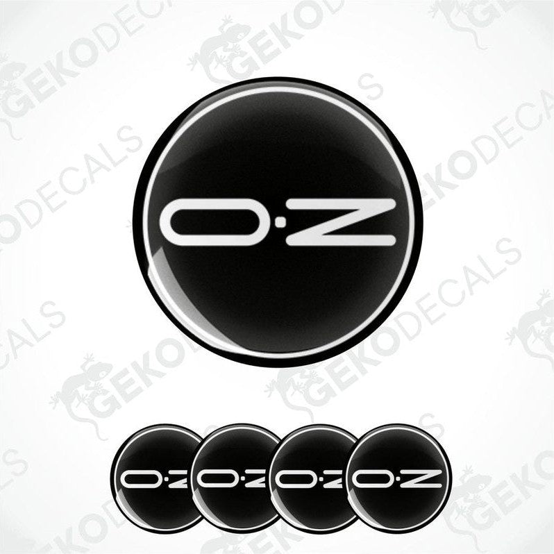 A set of black vinyl decals with the brand name 'OZ' on them, typically used as car wheel caps.