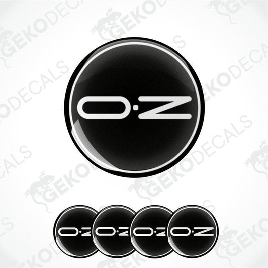 A set of black vinyl decals with the brand name 'OZ' on them, typically used as car wheel caps.