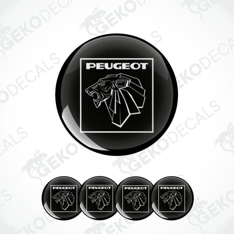 A set of black vinyl decals with the PEUGEOT logo applied on them, displayed on a white background.