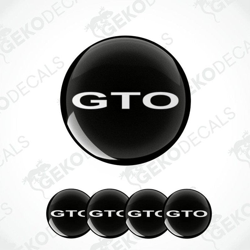Set of four black vinyl decals with the 'GTO' logo in white, designed for use as car wheel caps.