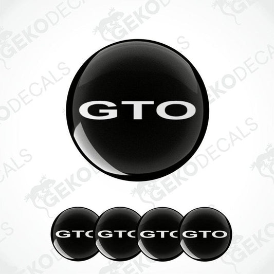 Set of four black vinyl decals with the 'GTO' logo in white, designed for use as car wheel caps.
