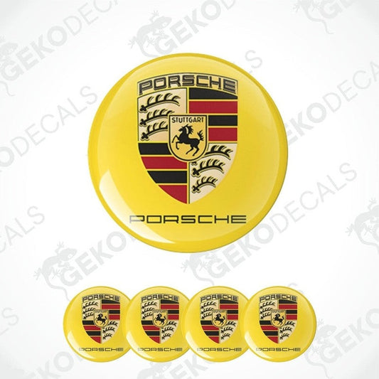 A set of four yellow vinyl decals with the PORSCHE logo and a shield design in the center, displayed against a white background.