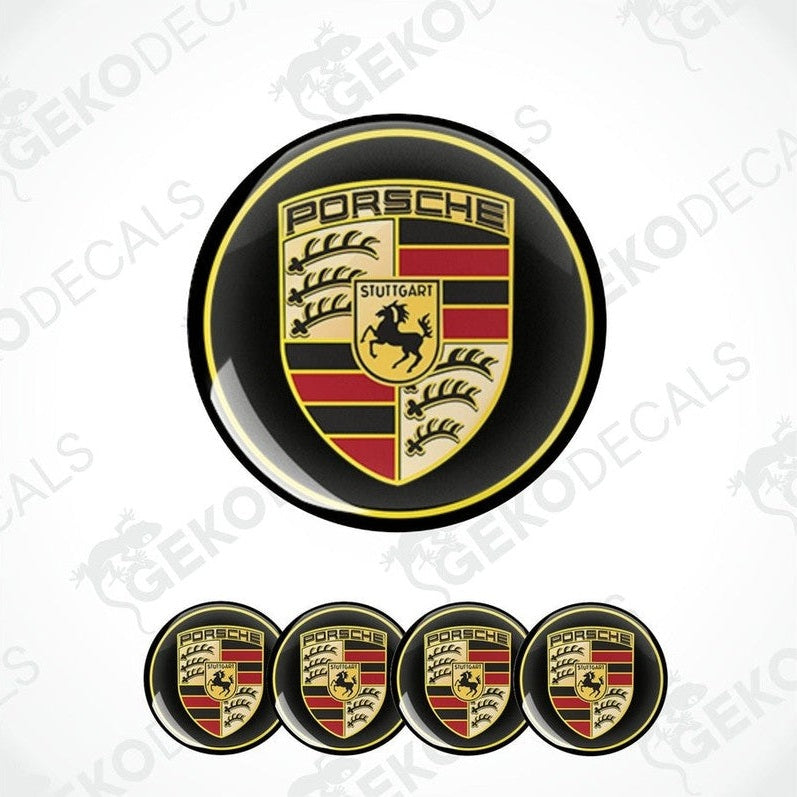 A set of four black, red, gold, and white vinyl stickers with a Porsche logo design.