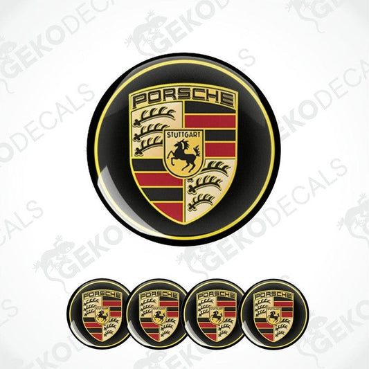 A set of four black, red, gold, and white vinyl stickers with a Porsche logo design.