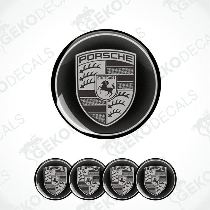 A set of four black and grey Porsche car wheel decals.