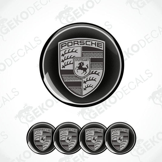 A set of four black and grey Porsche car wheel decals.