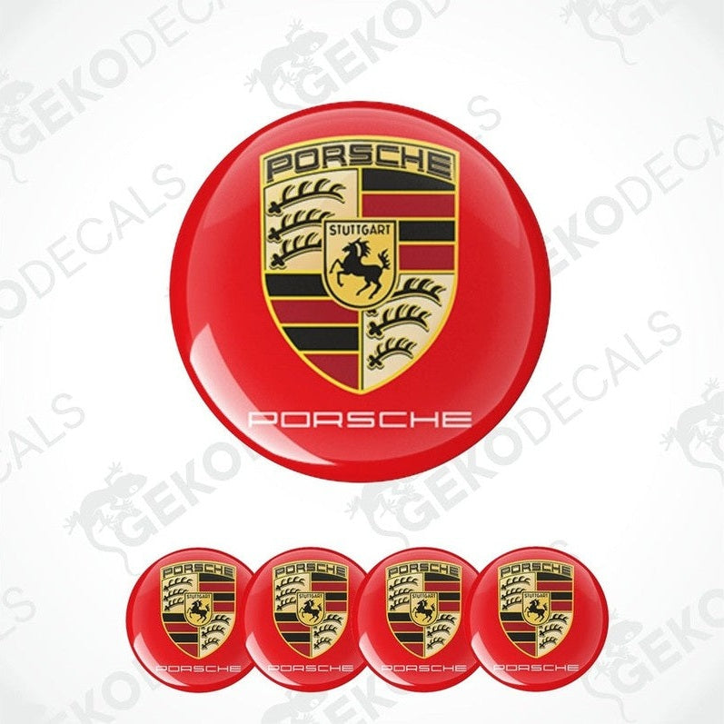 A set of four red vinyl stickers with a Porsche logo and the word 'Porsche' written on each sticker.