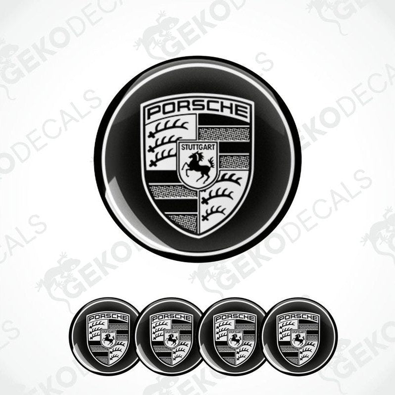 A set of four black vinyl stickers with a PORSCHE logo design, displayed against a white background.