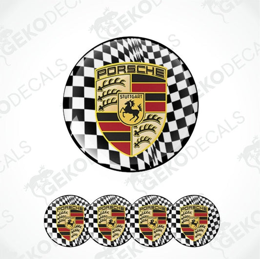 A set of four black, red, and white checkered vinyl stickers with the Porsche brand logo in the center.
