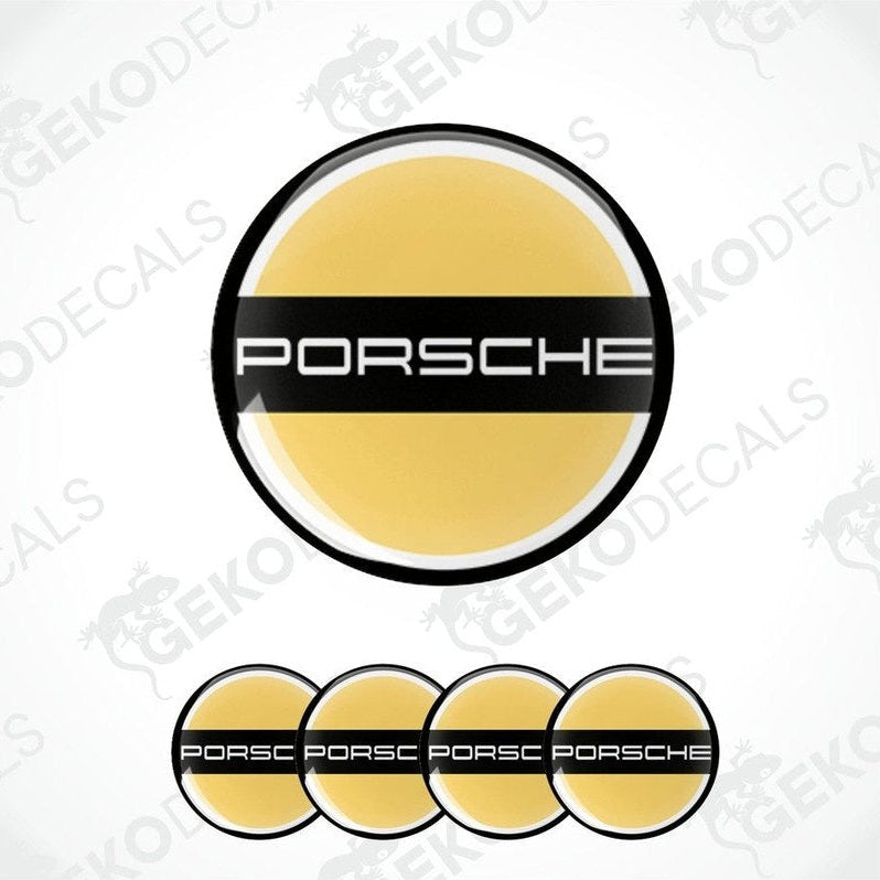 A set of four PORSCHE branded vinyl stickers with a yellow and black design and a polyurethane coating.