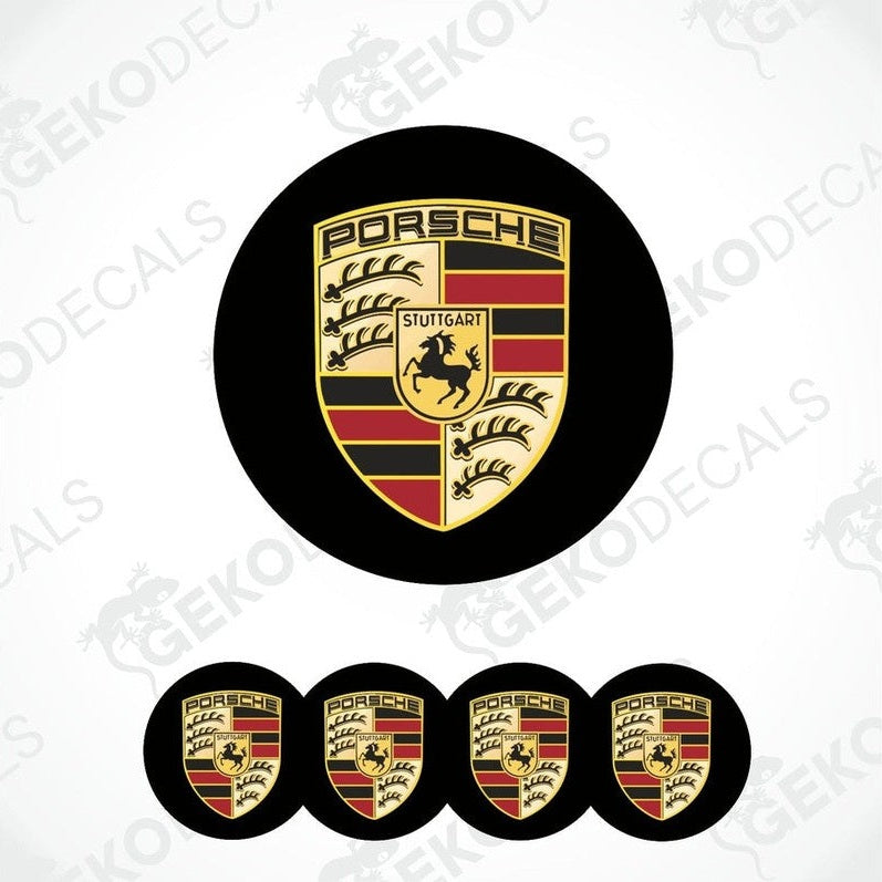 A set of four black, red, and gold Porsche branded vinyl stickers, with a dome shape and a polyurethane coating.