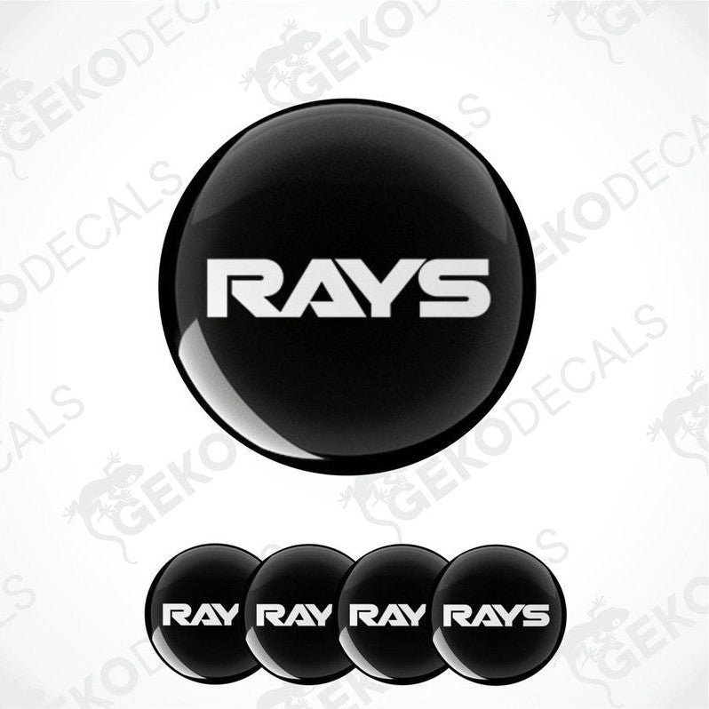 A set of black vinyl decals with the text 'RAYS' on them, typically used as car wheel caps.