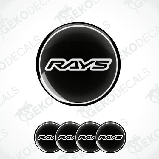 A set of four black vinyl stickers with the word 'RAYS' printed on them, placed against a white background.