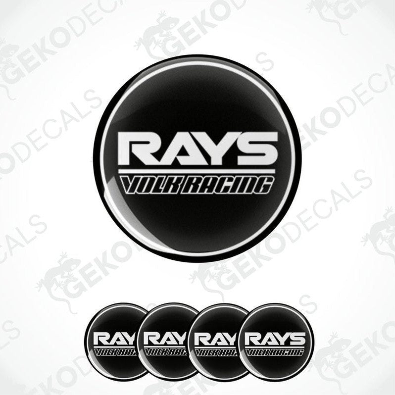 A set of four black vinyl stickers with the text 'RAYS VOLK RACING' in white.