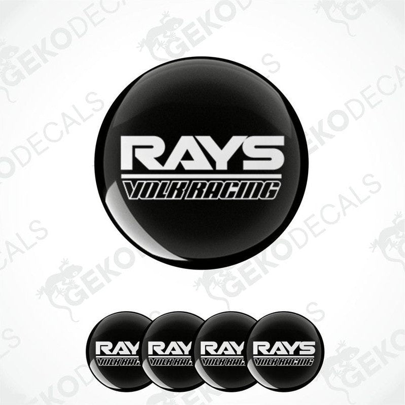 A set of four black vinyl stickers with the text 'RAYS VOLK RACING' in white.