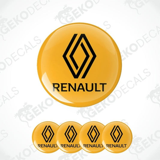 A set of four yellow vinyl decals with the RENAULT logo applied on a surface.