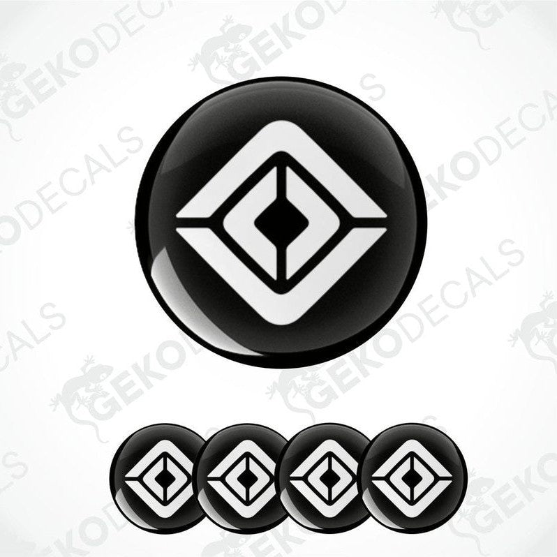 A set of four black and white geometric patterned decals, likely designed for vehicle wheels or caps.