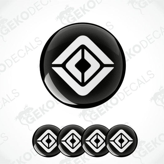 A set of four black and white geometric patterned decals, likely designed for vehicle wheels or caps.