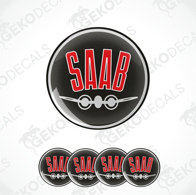 A set of four black vinyl stickers with the word 'SAAB' and an airplane graphic in red and white.