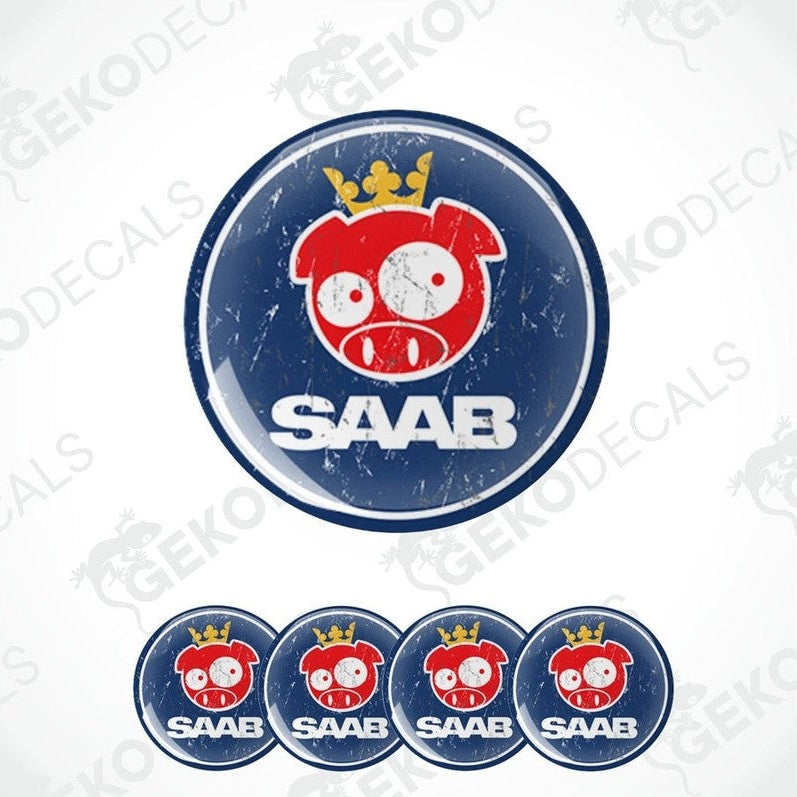 A set of round vehicle decals featuring a cartoon pig character with a crown and the SAAB car brand name.