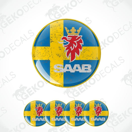 A set of four blue vinyl stickers with a yellow and red emblem in the center, and the text 'SAAB' below the emblem.