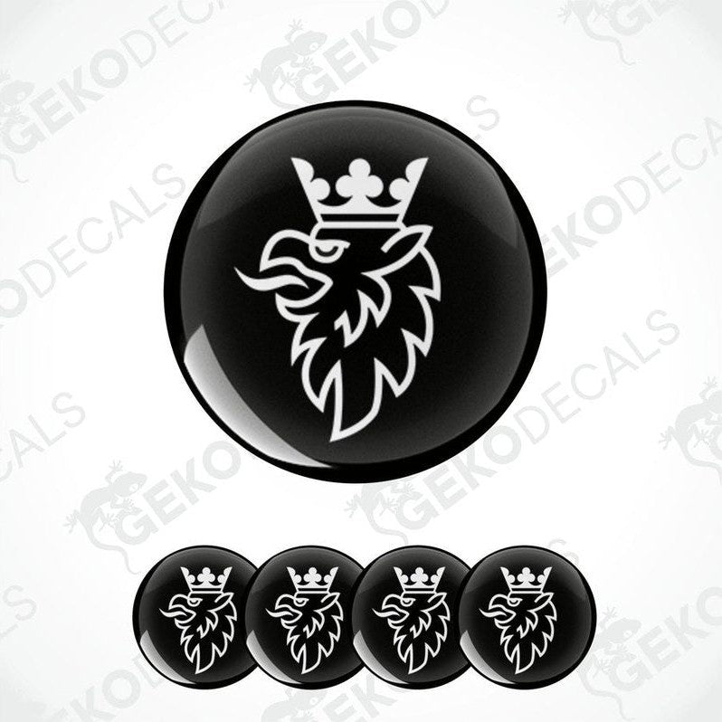 A set of four black vinyl stickers with a white logo of a scania and crown design.