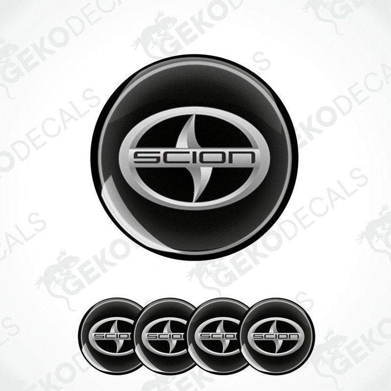 A set of four black vinyl stickers with a SCION logo design, displayed against a white background.