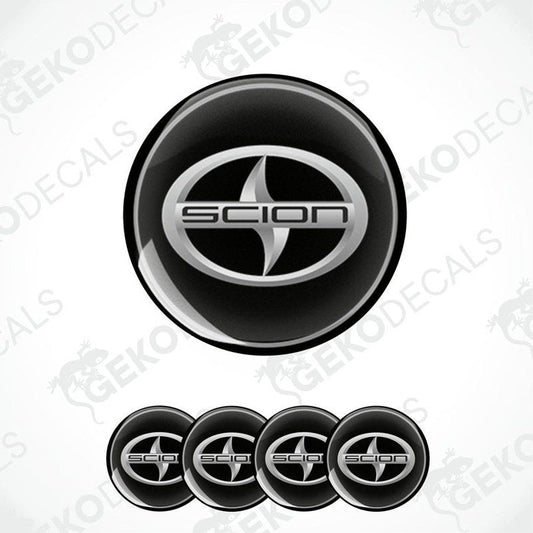 A set of four black vinyl stickers with a SCION logo design, displayed against a white background.