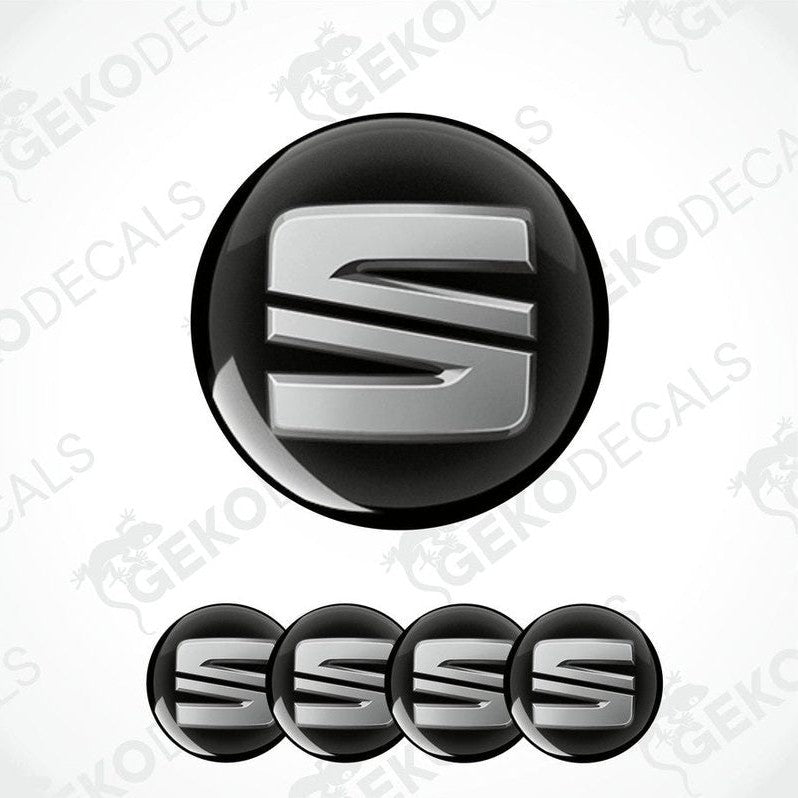 Set of four black vinyl decals with polyurethane coating, featuring the SEAT logo in silver color.