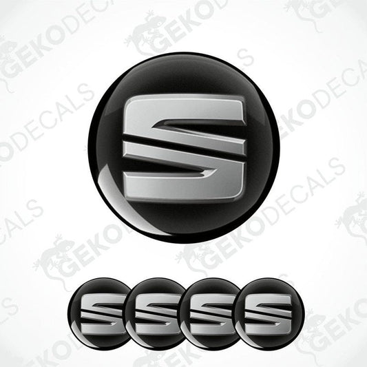 Set of four black vinyl decals with polyurethane coating, featuring the SEAT logo in silver color.