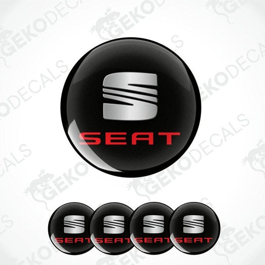 Set of four round car decals with the SEAT logo in black, red, and white colors.
