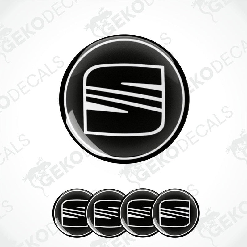A set of four black and white vinyl stickers with a geometric design, including the word 'SEAT' on a white background.