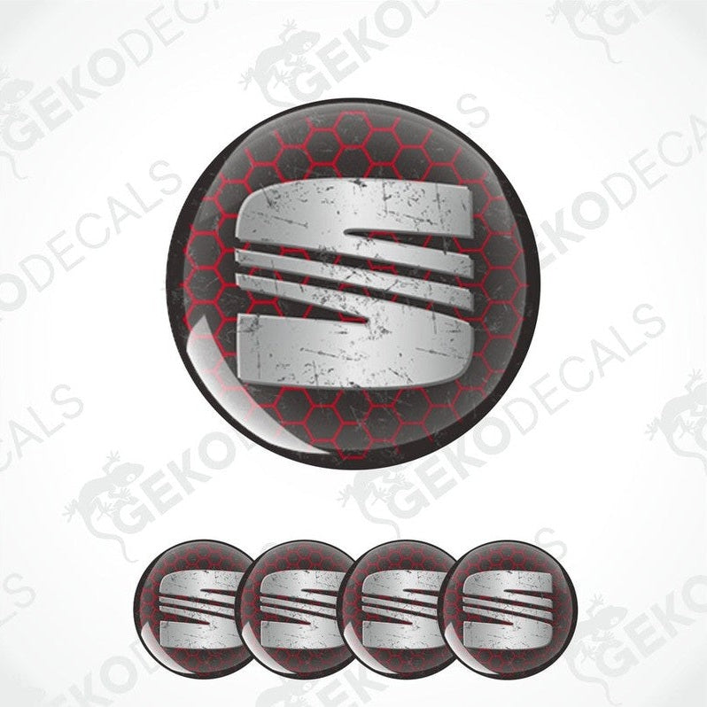 A set of four circular vinyl stickers with a red, black, and silver color scheme and the letter 'SEAT' in the center.