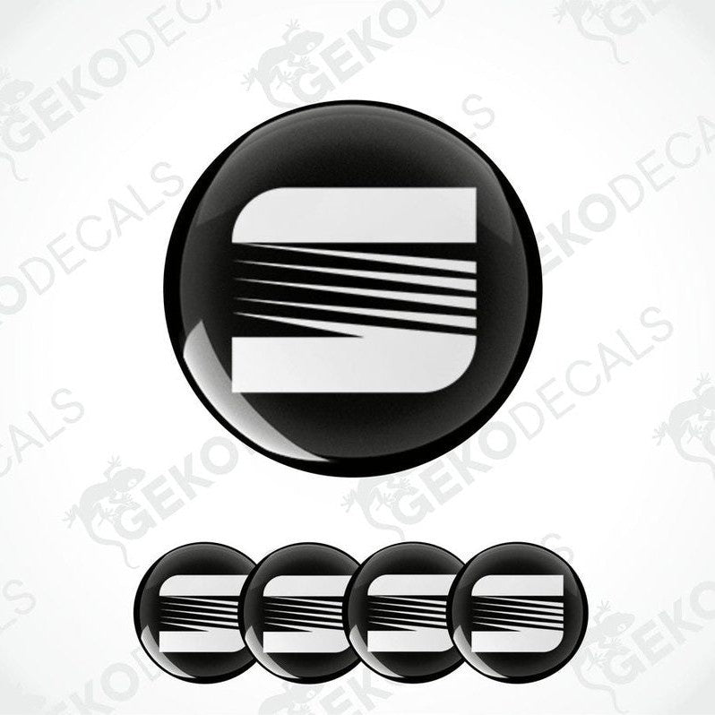 Set of four vinyl decals with polyurethane coating, featuring the SEAT logo in black and white.