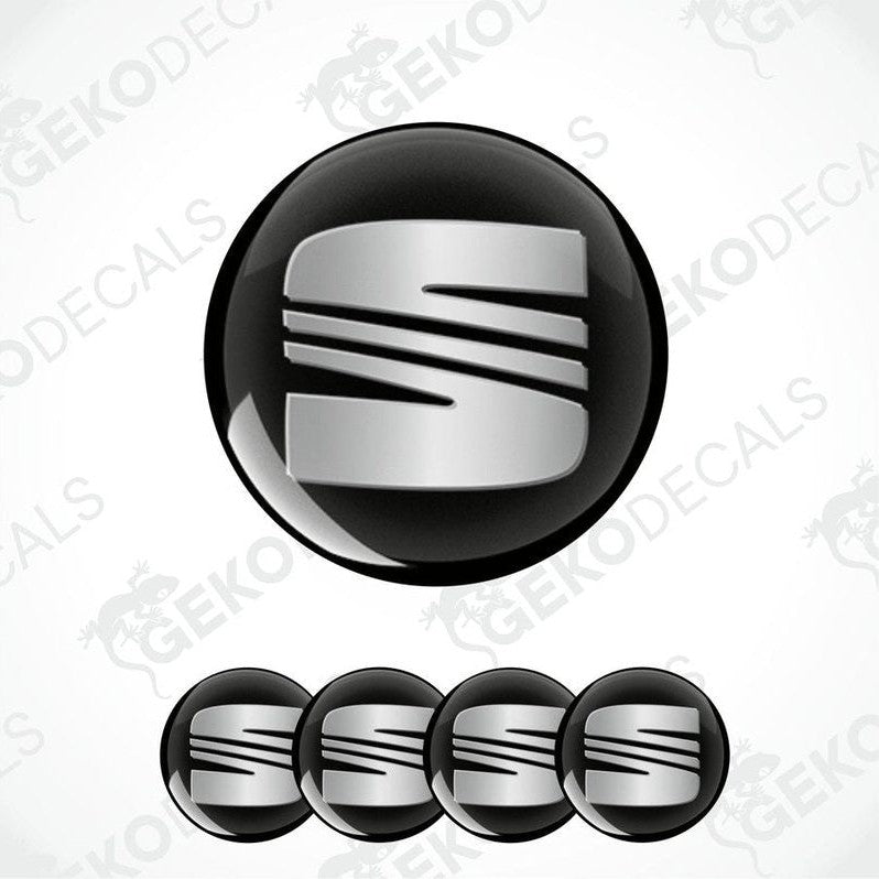 Set of four round car decals with the SEAT logo in black and silver colors.