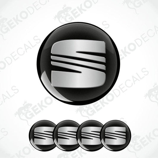 Set of four round car decals with the SEAT logo in black and silver colors.