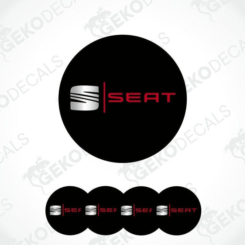 A set of four black vinyl decals with the 'SEAT' logo in silver and red color.