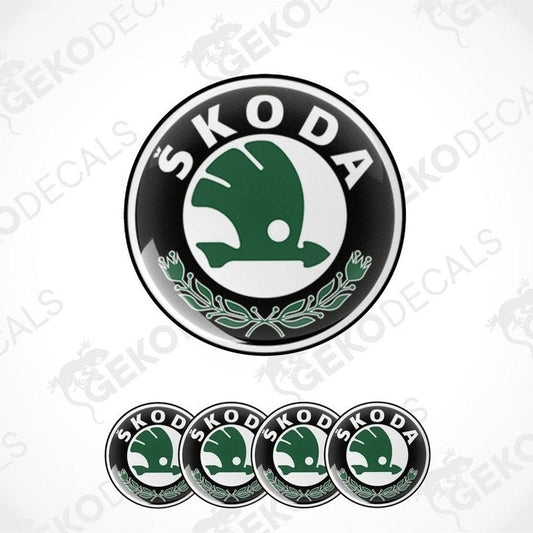 A set of four vinyl decals with a polyurethane coating featuring the SKODA logo in green and white on a black background.