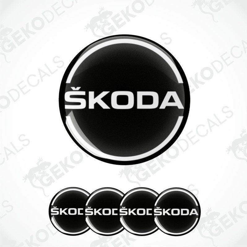 A set of black, and white Škoda branded vinyl decals designed for use on car wheels.