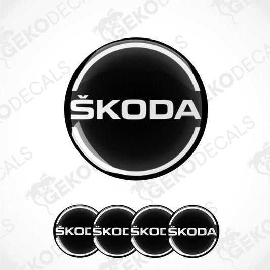 A set of black, and white Škoda branded vinyl decals designed for use on car wheels.
