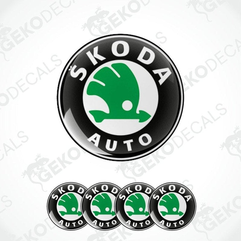 A set of four vinyl decals with a polyurethane coating featuring the SKODA AUTO logo in green and white on a black background.