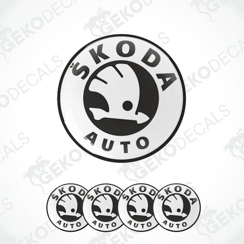 A set of four black and white vinyl decals with the Skoda auto logo.