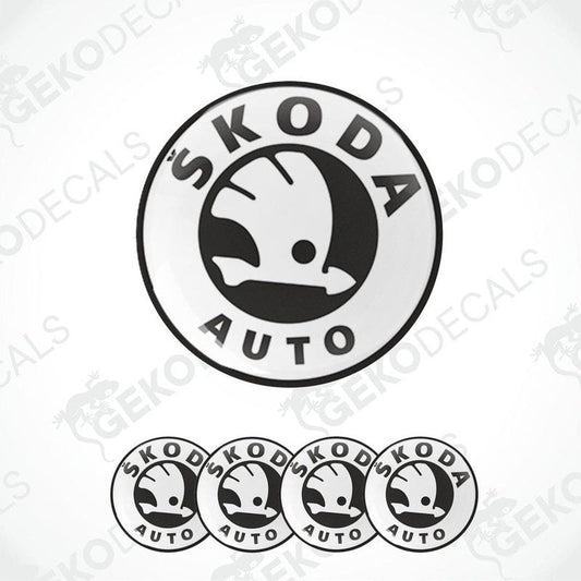 A set of four black and white vinyl decals with the Skoda auto logo.