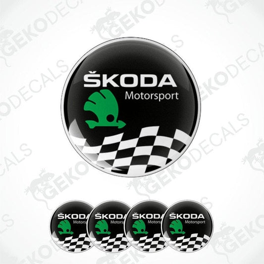 A set of four circular vinyl stickers with a ŠKODA MOTORSPORT logo, featuring a green and black color scheme with a checkered pattern.