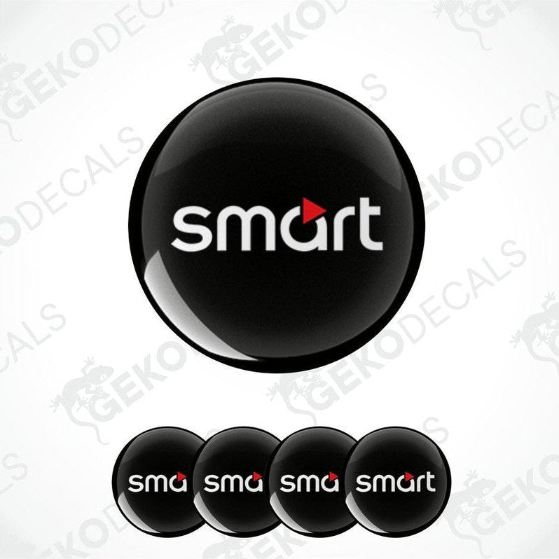 A set of four round car decals with the smart car logo in black, red, and white colors