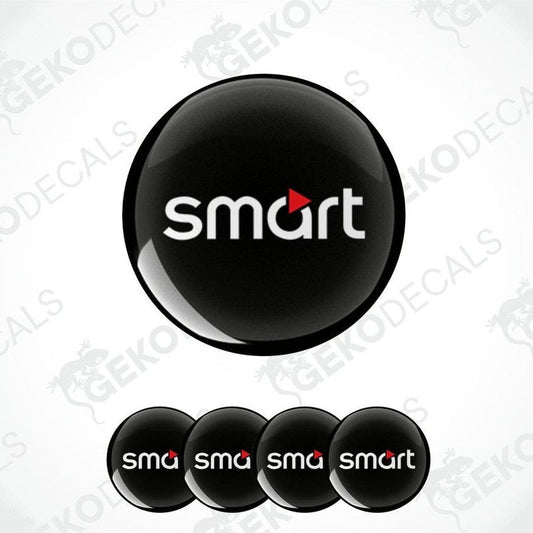 A set of four round car decals with the smart car logo in black, red, and white colors