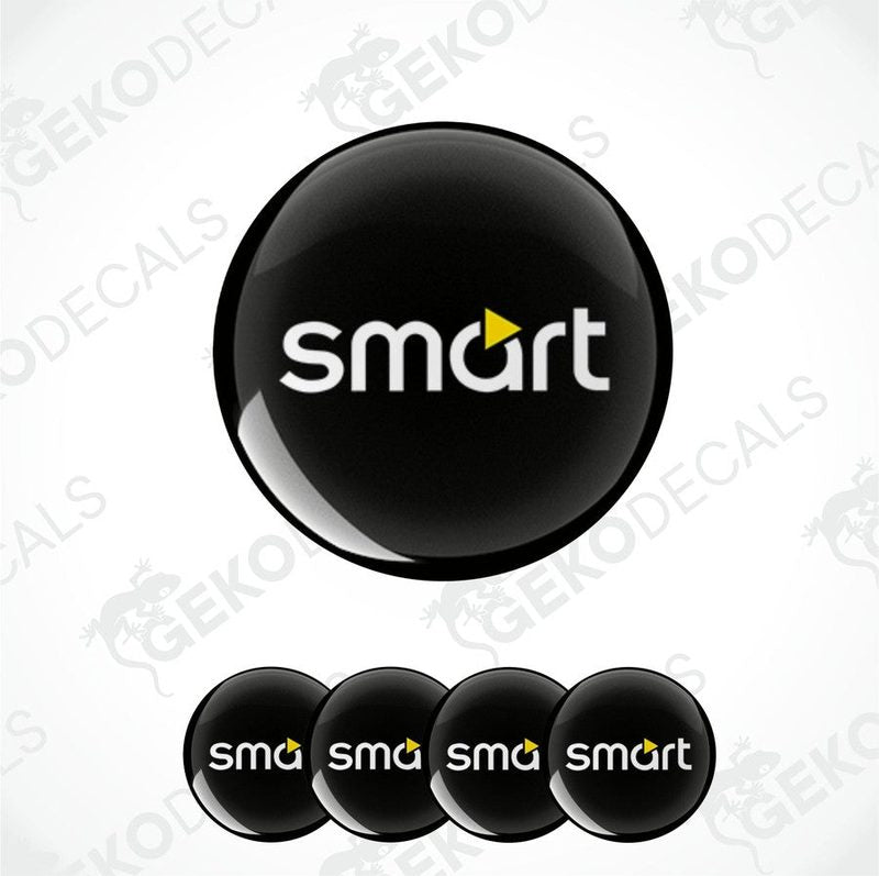 A set of four round car decals with the smart car logo in black, yellow, and white colors.